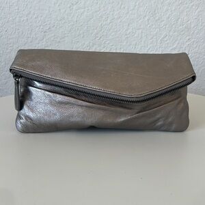 Gently used metallic asymmetrical envelope clutch.